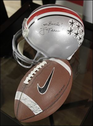 Ohio State football memorabilia including a helmet autographed by former coach Jim Tressel decorate the renovated room.