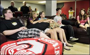 Jarred Wise, 13, second from right, is joined by his brother Matt, 16, left, cousins Taryn Wise, 14, and her twin, Taylor, and Tiffanie Helm in the renovated basement of Jarred's home. Jarred, an eighth grader at Anthony Wayne Junior High School, is undergoing treatment for leukemia. 