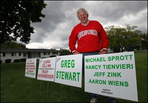 Gene Stock has found a way to post signs for candidates ahead of the usual date: He wishes them happy birthday.