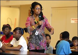 ‘What do you walk away with?’ Angela Hickman-Richburg, Robinson Elementary assistant principal, asks on the last day of school. She prodded the students Tuesday
until they mustered up enthusiasm.