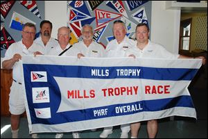 Winners of the 2012 Mills Trophy race, saling Irish Mist, were Dave Spiers, skipper; Time Radwanski, TYC rear commodore; Bill Tucker, crew; Barry Vincent, TYC vice commodore; Jim Balogh, TYC commodore, and Andy Spiers, crew.