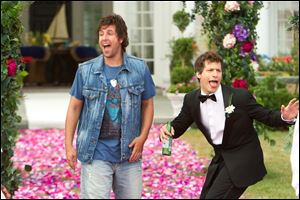 Adam Sandler, left, and  Andy Samberg play too dumb to be funny in 'That's My Boy.'