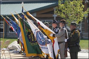 An honor guard presides at the grand opening of the U.S. Customs and Border Protection’s $25 million Sandusky Bay Station near Port Clinton. The flags represent the organizations to be housed there.
