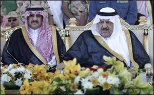 Interior minister Nayef bin Abdul-Aziz, right, and his son, deputy to the Saudi Interior Minister, Prince Mohammed bin Nayef, attend a ceremony of the Saudi armed forces.