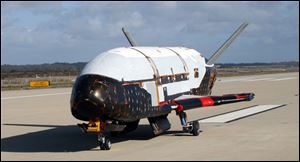 An image provided by the U.S. Air Force shows the X-37B spacecraft. The unmanned Air Force space plane steered itself to a landing early Saturday, at a California military base, capping a 15-month clandestine mission. 