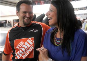 Jarrad Egert, an engine specialist in Joey Logano's crew, and his wife, Wendy Venturini, a reporter for SPEED TV, travel across the Sprint Cup circuit with their young son, Caleb.