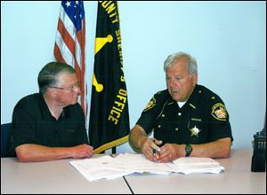Tom Redmond, left, a candidate for Monroe County sheriff, is endorsed by James Telb, sheriff of Lucas County, right. Sheriff Telb is not seeking re-election this fall.
