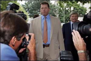 Former Major League Baseball pitcher Roger Clemens, left, with his attorney Rusty Hardin, far right, arrives at federal court in Washington for the verdict in his trial on charges of lying to Congress in 2008 when he denied ever using performance-enhancing drugs. 
