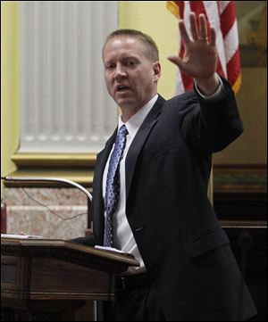 Fulton County Prosecutor Scott Haselman, left, calls the accused, Walter Zimbeck II, a controlling ex-boyfriend of Lori Ann Hill, who was killed in 1985 at age 14.