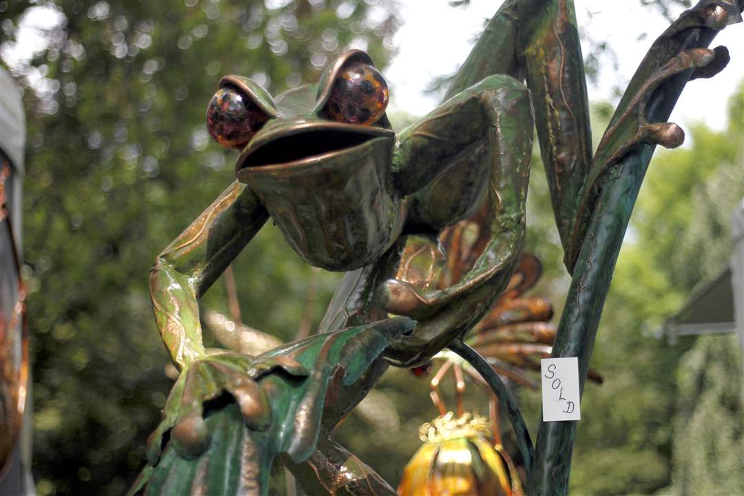 A-copper-bronze-and-glass-frog-sculpture-called-Golum