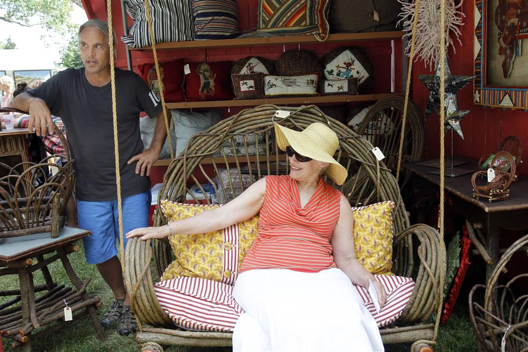 Linda-Younker-right-from-Gibsonburg-takes-a-ride-on-a-swing