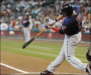 Cleveland Indians' Shin-Soo Choo, of South Korea, flies out to left field against the Houston Astros in the first inning of a baseball game Saturday.