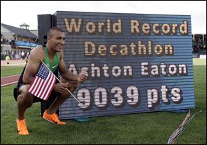 Ashton Eaton poses for a picture after the 1500m during the decathlon competition at the U.S. Olympic Track and Field Trials Saturday  in Eugene, Ore. Eaton finished the decathlon with a new world record. 