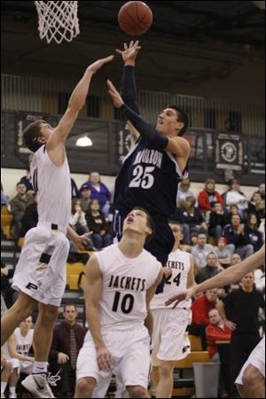 Jordan Lauf, taking a shot against Perrrysburg, led the Northern Lakes League by scoring 21.9 points per game.
