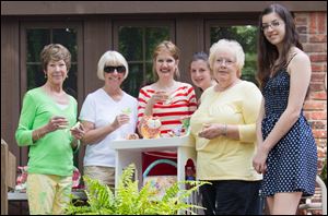 Audrey Bruggemann, left, one of the gardenters featured during the In Another Garden tour, welcomed guests including Cheri Gosine, Jan Pugh of Packer Creek Pottery, Amy Bruggemann, Pat Scheuer of Toledo Day Nursery, and Erin Bruggemann.