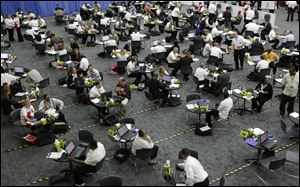 Military veterans receive career counseling in Detroit. The number of people seeking jobless benefits in the United States fell last week, but the level remains too high to signal pickup in hiring.