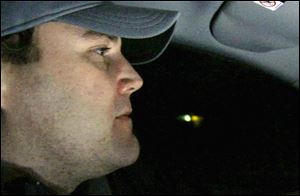 In this image from an Obama campaign ad, Toledoan Brian Slagle, an auto-parts maker, drives through rain on I-475 to his job. In the ad, Mr. Slagle credits the auto bailout and the President for saving his job and the industry.