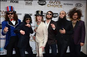 Eric Nally, second from left, fronts the Cincinnati band Foxy Shazam.