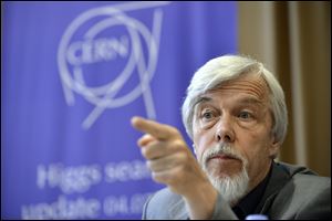 Rolf Heuer, Director General of CERN (European Organization for Nuclear Research), answers a journalist's question about the scientific seminar to deliver the latest update in the search for the Higgs boson at the European Organization for Nuclear Research (CERN) in Meyrin near Geneva, Switzerland.