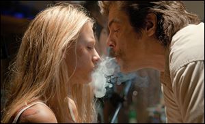 Blake Lively, left, and Benicio Del Toro star in 'Savages.'