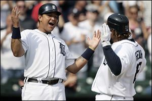 Detroit Tigers' Prince Fielder, right, celebrates his three-run home run with Miguel Cabrera in the eighth inning of a baseball game today against the Minnesota Twins. The Tigers won 7-3. 
