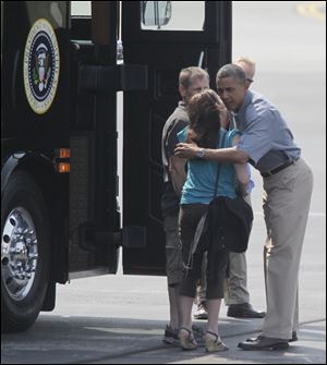 Jeff and Cheri Armes greet the President before boarding the bus with him as he begins his tour of the area.