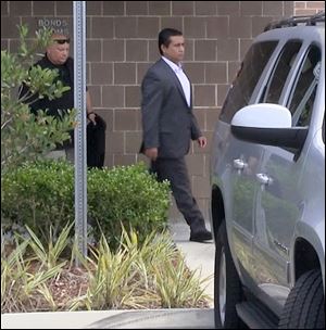 George Zimmerman leaves the Seminole County Jail after posting bail, Friday.