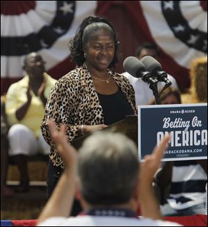 Ina Sidney, a Chrysler plant worker, introduces President Obama at the Wolcott House Museum in Maumee. 