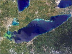 This satellite photo shows Lake Erie in 2011. The green coloration at left is an algae bloom that grew over a section of the lake.