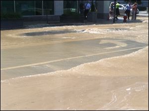Downtown Toledo streets are flooded after a water main break.
