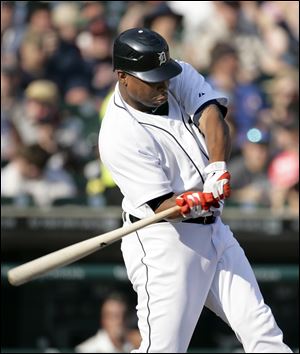 Detroit Tigers' Delmon Young swings on his seventh-inning two-run home run against the Kansas City Royals in a baseball game on Saturday.