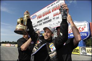 Vincent Nobile celebrates after winning Sunday's Pro Stock title race in Norwalk. The win followed his all-star victory on Saturday.