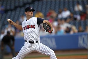 Jacob Turner, of the Toledo Mud Hens, prepares to launch a ball toward Ezequiel Carrera, of the Columbus Clippers.