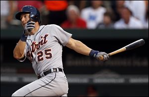 Ryan Raburn smacks an RBI-double during the fourth inning for the Tigers to score Alex Avila in their game against the Orioles. 
