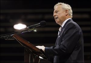 John Carroll, chairman of the Jehovah's Witnesses, addresses the conference at the SeaGate Convention Centre in downtown Toledo. The conference that began Friday is the fourth of six here this summer.