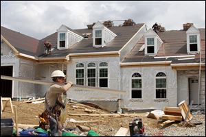 New home construction, like this home in Bridgeville, Pa., is rising. A national index measuring builder sentiment increased in June to its highest level since May, 2007.