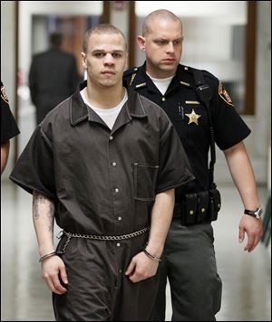 Cameo Pettaway is escorted from the Lucas County Common Pleas Court. He is charged in the slayings of a Springfield Township couple.