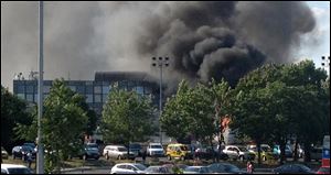Smoke rises into the sky after an explosion at Burgas airport, outside the Black Sea city of Burgas, Bulgaria, some 400 kilometers (250 miles) east of the capital, Sofia. A bus carrying young Israeli tourists in a Bulgarian resort exploded.