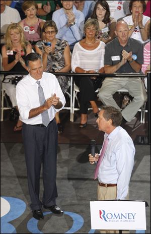 Republican presidential candidate Mitt Romney and Governor John Kasich speak to supporters at the Bowling Green Community  Center Wednesday, 07/18/12, in Bowling Green, Ohio.