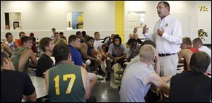 Ohio State assistant coach Zach Smith, a grandson of former OSU coach Earle Bruce,  talks to players who will participate Friday in the Perrysburg all-star game.