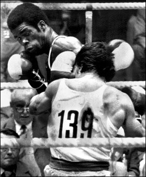 Louis Self of Toledo lands a punch against Angelos Theotokatos of Greece in a featherweight bout Self won in the 1972 Munich Games.