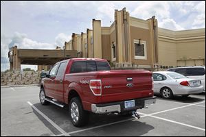Two vehicles with Michigan license plates are parked at Hollywood Casino Toledo. A recent plate check showed roughly two-fifths of vehicles were from Michigan. 
