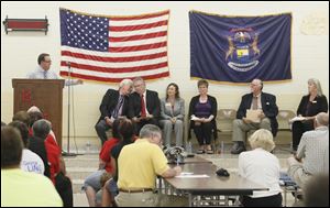 Moderator Dustin Cress, far left, introduces, seated, from left, supervisor candidates Walt Wilburn, and Greg Stewart, clerk candidates Trudy Hershberger and Gail Hauser-Hurley, and treasurer candidates Paul Francis and Laura Collins during a Bedford Republican Club forum on Thursday.
