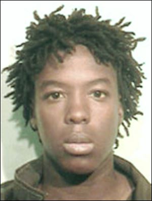 Kenneth Moore was arrested after an off-duty officer recognized his resemblance to a suspect in a sexual assault. 