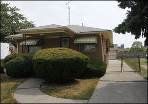 This house at 802 Waverly Ave. is one of 23 properties owned by City Councilman Tyrone Riley. Earlier this year, Mr. Riley faced the threat of water shut-off at at least one property after he racked up unpaid bills totaling $8,680 on 14 houses.