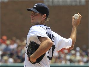 Detroit Tigers pitcher Jacob Turner throws during the second inning Sunday in Detroit, where the Tigers beat the Chicago White Sox 6-4. Detroit is 1  1/2 games ahead of Chicago in the AL Central Division.