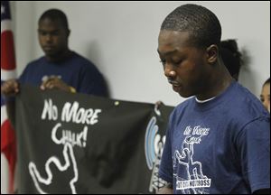 Isaiah Middlebrooks, 17, announces a project aimed at addressing violence in neighborhoods. He spoke at One Government Center.