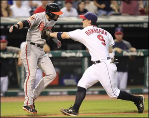 Indians third baseman Jack Hannahan tags out Baltimore's Nick Markakis in the eighth inning.