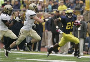 Fitzgerald Toussaint, a redshirt junior from Youngstown,  ran for 1,041 yards and nine touchdowns and caught six passes and a touchdown during 12 games in 2011.