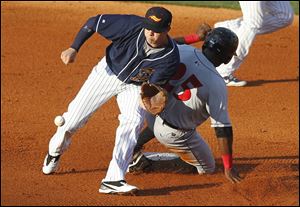Mud Hens second baseman Cale Iorg waits for the throw as Indianapolis' Brandon Boggs steals second during a game at Fifth Third Field on Monday evening.